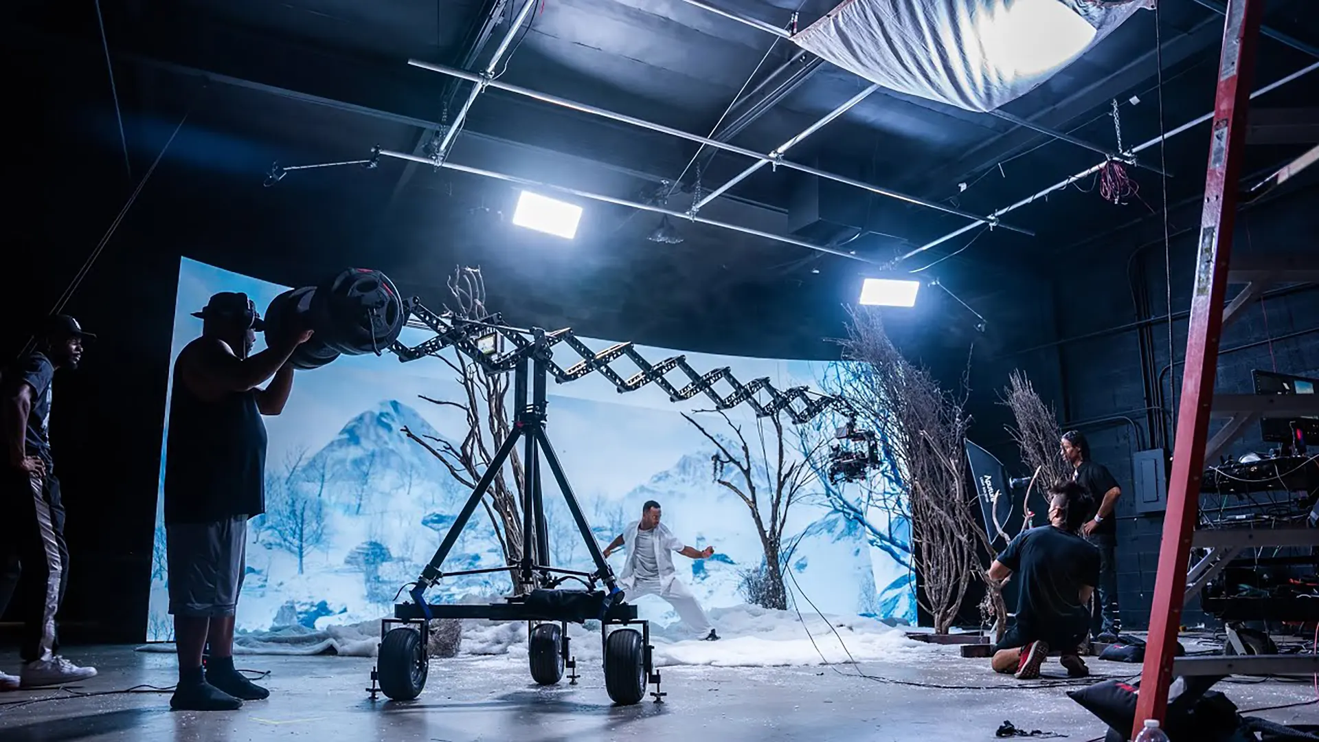 Virtual production stage with a camera dolly and an LED backdrop